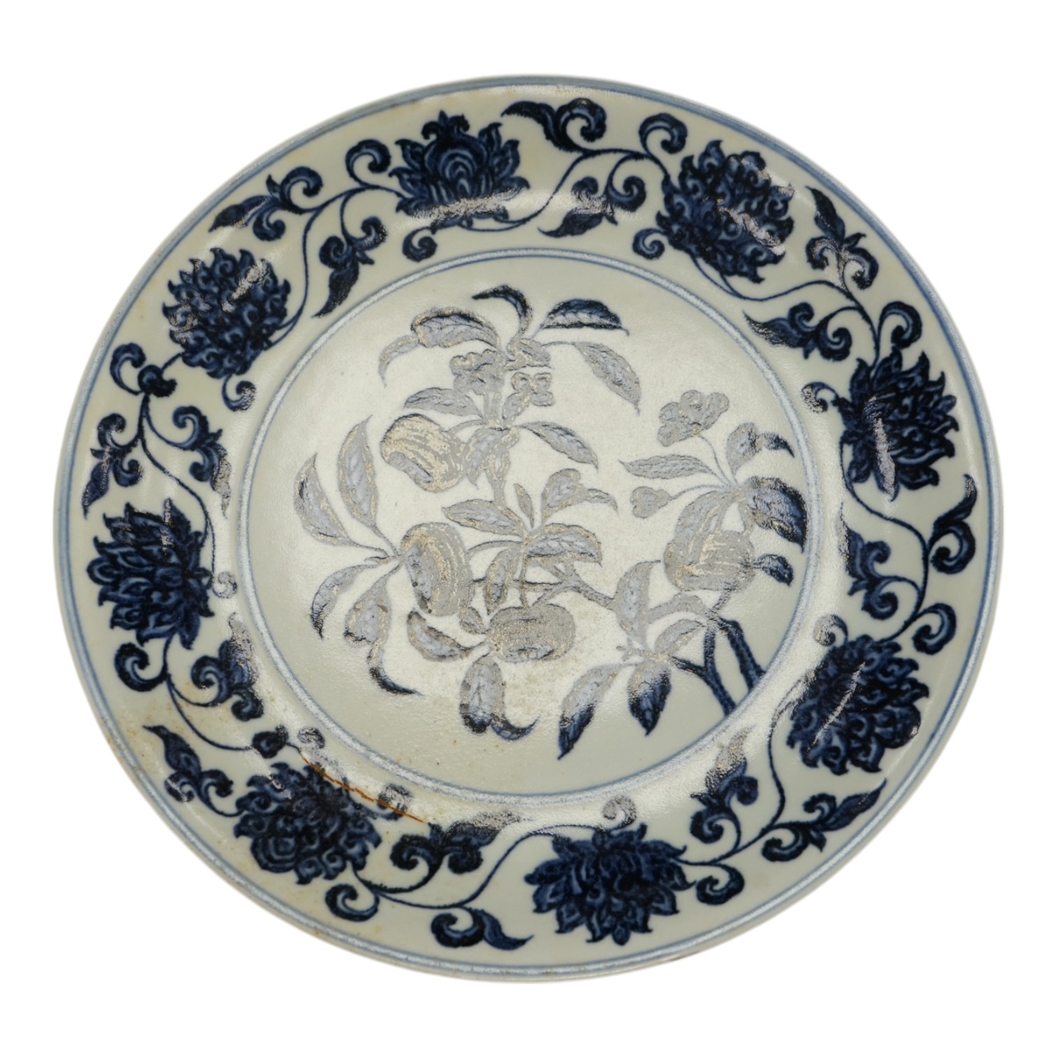 A Chinese blue and white pomegranate dish, 33cm diameter, Condition - firing crack to surface of dish